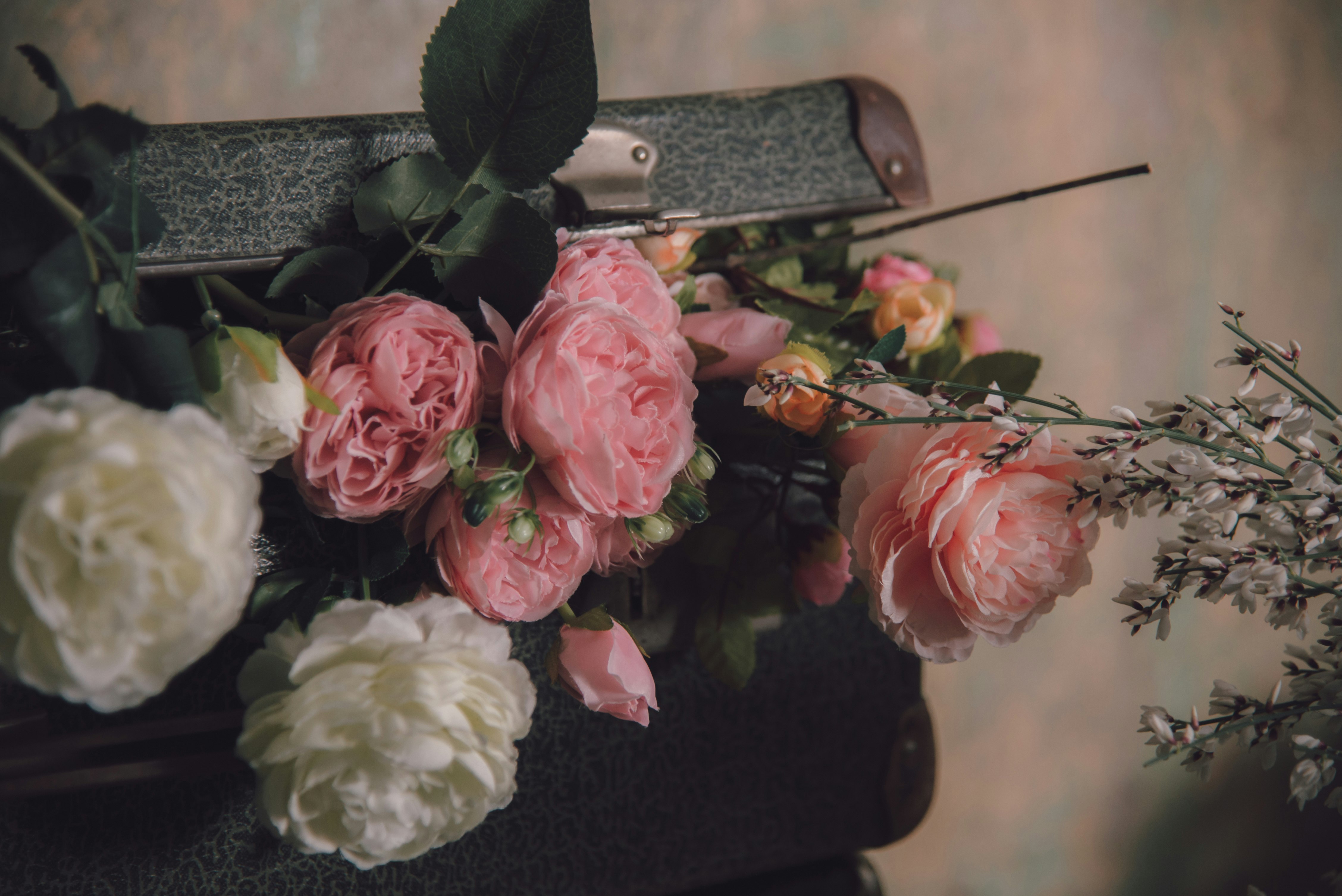 faux pink and white roses inside bag